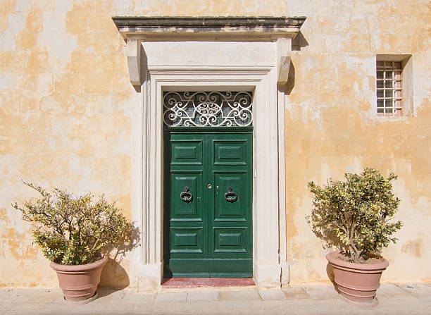 Green wooden door. Painted doors of Malta series.