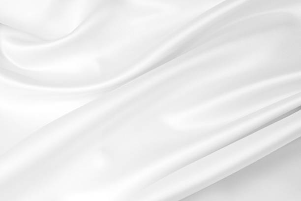 White silk Closeup of rippled white silk fabric satin stock pictures, royalty-free photos & images