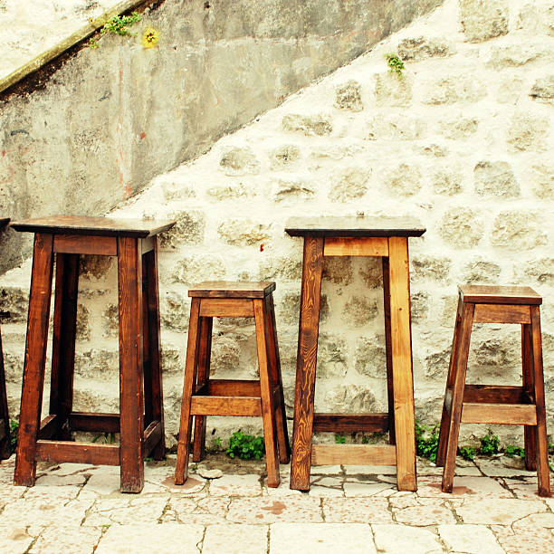 wooden tables and stools in the street