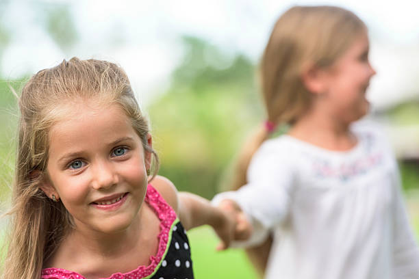 istock Little girls playing 489206404