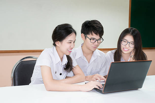 Group of Asian student in uniform E-learning through Laptop in classroom - https://media.istockphoto.com/id/489208378/photo/group-of-asian-student-in-uniform-e-learning-through-laptop.jpg?s=612x612&w=0&k=20&c=P27Udfa5xyZ31eWOP2MvQzyMzbykzNKTtx3Bow6xYoE=