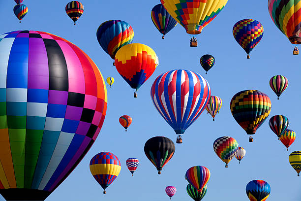 New Jersey Balloon Festival The mass ascension launch of over 100 colorful hot air balloons at the New Jersey Ballooning Festival in Whitehouse Station, New Jersey  as a early morning race. ballooning festival stock pictures, royalty-free photos & images