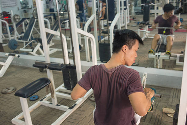 istock Young athlete exercising in the sport center 489210744