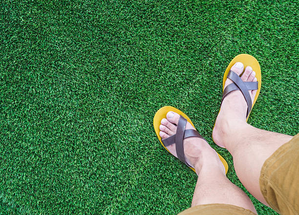 istock my leg over green grass background 489211660