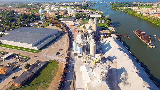 istock Coal Train Rolling Through Scenic Industrial Park, River, Aerial View 489213868