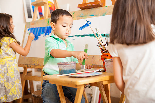 istock Little kids painting in art class 489216252