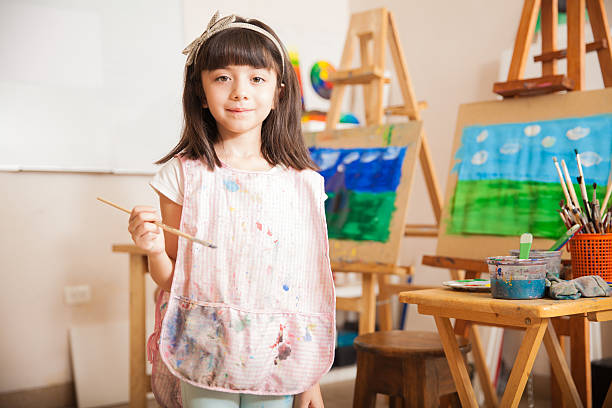 istock Cute little artist at school 489216748