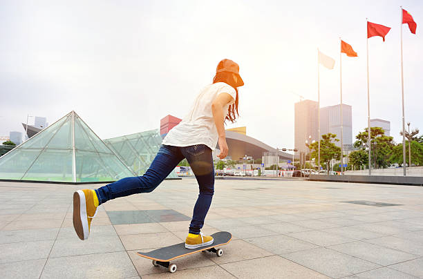 istock speeding skateboarding woman 489218623