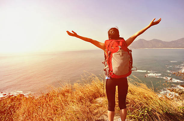 istock cheering hiking woman happy seaside 489218827