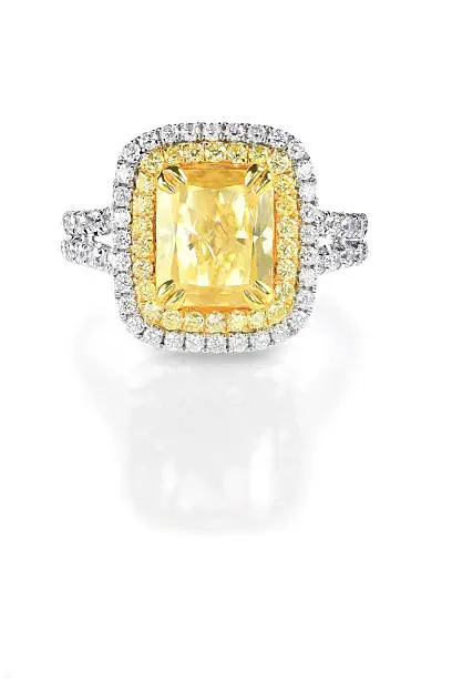 Three tone yellow canary diamond engagement ring with a double halo setting.A beautiful diamond brilliant princess cut stone is set sideways to create unique style set in white gold or platinum surrounded by beautiful round diamonds.