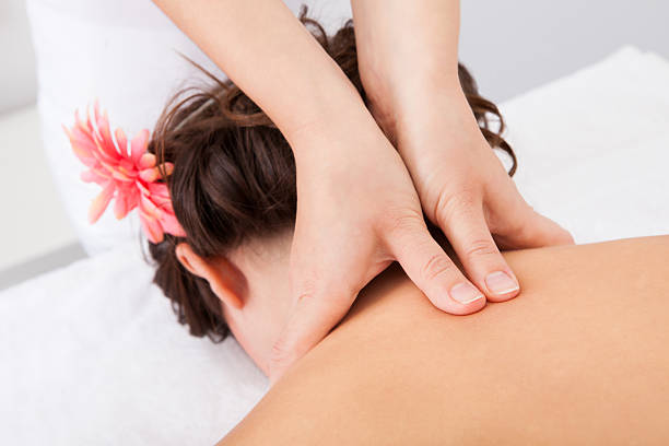 istock Woman Getting Treatment For Her Neck 489221599