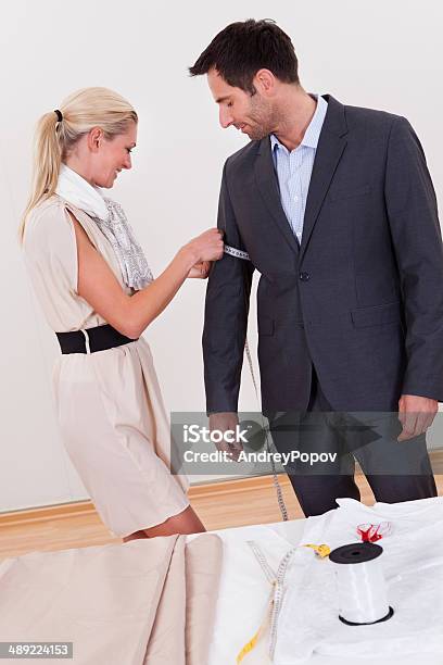 Seamstress Measuring A Man For A Suit Stock Photo - Download Image Now - Adult, Art And Craft, Beautiful People