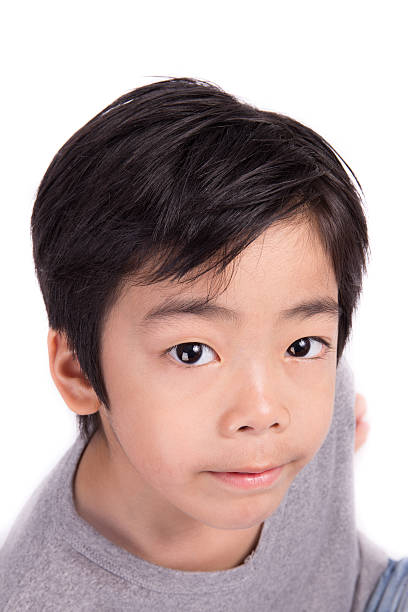 istock adorable asian boy looking at camera 489225135