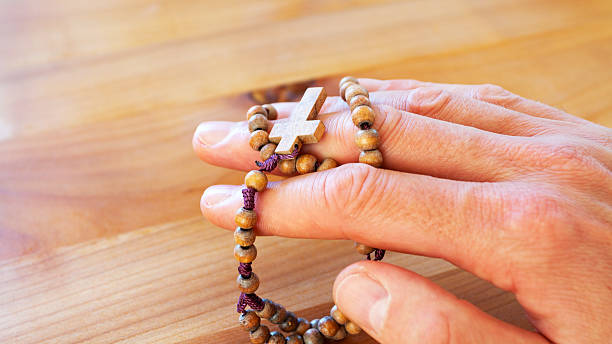 istock Rosary on male fingers 489226015