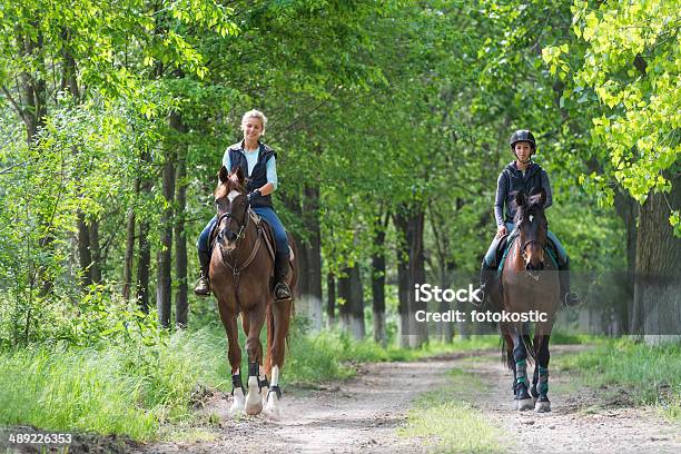 Girls On Horseback Riding Stock Photo - Download Image Now - Horseback Riding, Forest, Horse