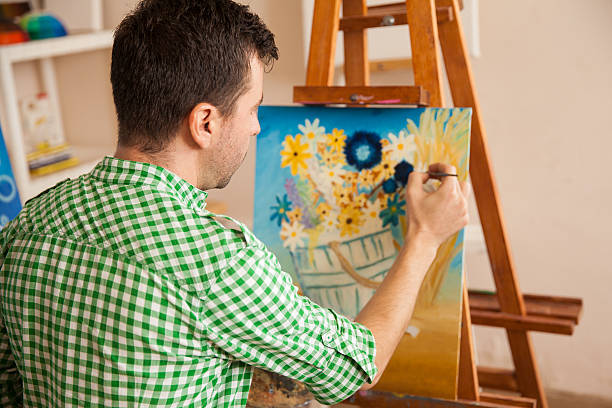 istock Young male artist at work 489243304