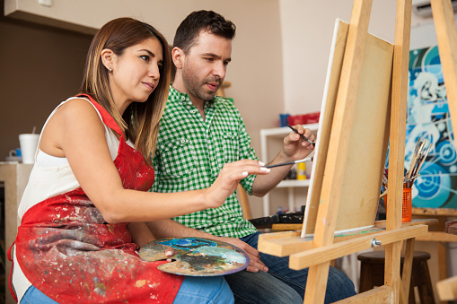 Couple Of Artists Working Together Stock Photo - Download Image Now -  Painting - Activity, Painting - Art Product, Couple - Relationship - iStock