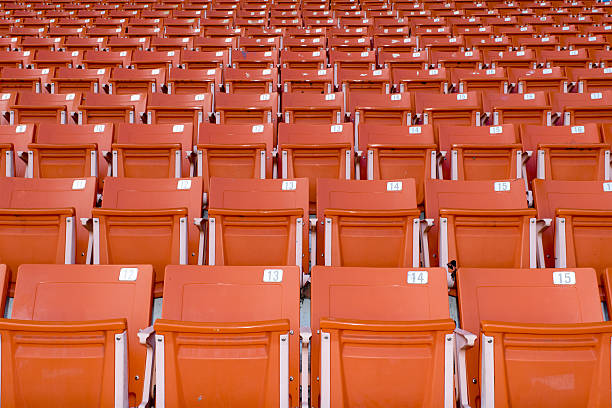 istock Orange stadium seats on the stadium sport 489244768