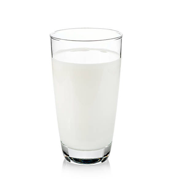 istock Glass of milk isolated on white 489244802