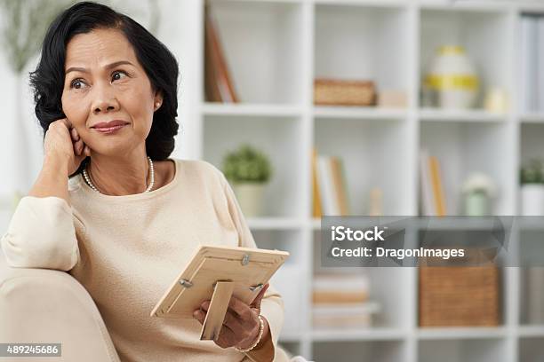 Thoughtful Woman Stock Photo - Download Image Now - Widow, Women, Senior Adult