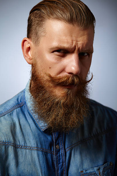 istock Bearded man. Handsome man with a beard and twirled mustache. 489249068