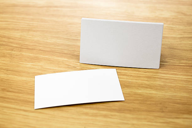 istock Blank Business card mock up on light wooden table, 489249948