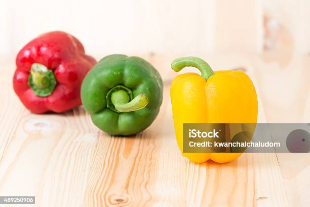 Yellow Sweet Peper On Wooden Background Stock Photo - Download Image Now - 2015, Bell Pepper, Colors