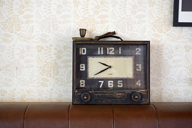istock Vintage clock on the brown leather sofa 489251046