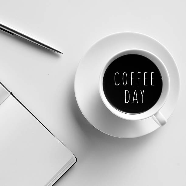 istock cup of coffee and the text coffee day 489251484