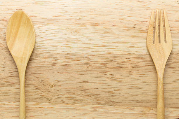 istock Wooden spoon and fork on wood background 489252656