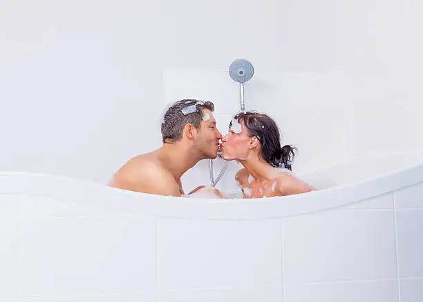 kissing lovely couple making home spa