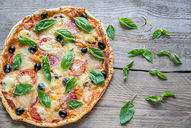 istock Pizza on the wooden board 489256836