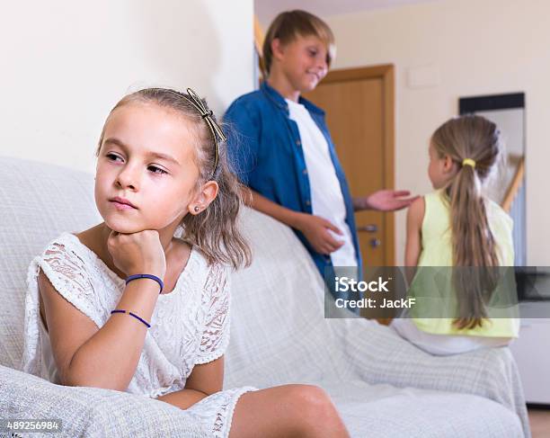 First Amorousness Girl And Couple Of Kids Apart Stock Photo - Download Image Now - 2015, Apartment, Arguing