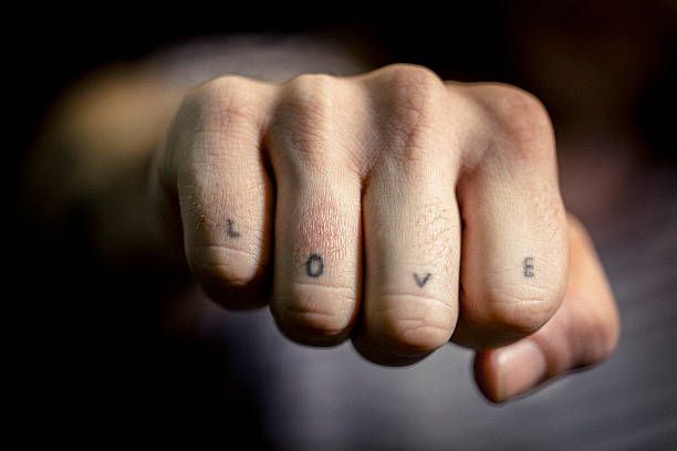 istock Man's hand with Love tattoo 489258092