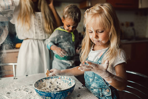 Kids is playing with flour stock photo
