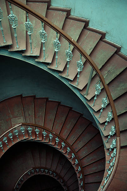 istock Ancient interior with old wooden spiral stairs 489268963