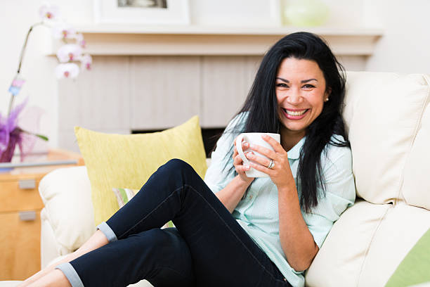 istock Beautiful Middle Age Woman enjoying hot tea 489269609