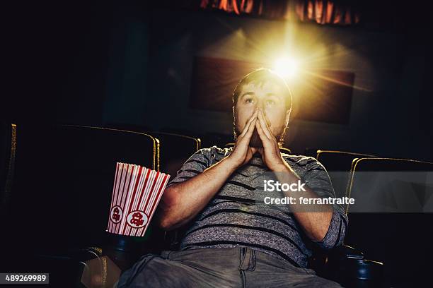 Lone Man At The Movies Stock Photo - Download Image Now - Critic, Movie Theater, Film Industry