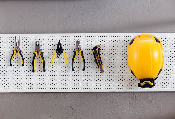 Set of tools on the wall cupboard stock photo