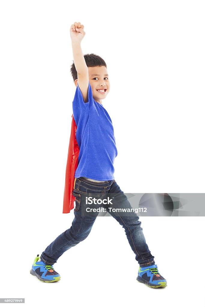 happy superhero kid hero raise hand happy superhero kid hero raise hand in studio Success Stock Photo