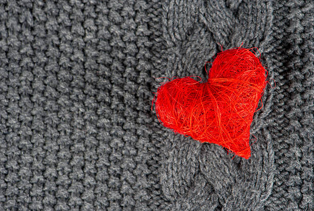 istock red heart of knitted wool background 489274421