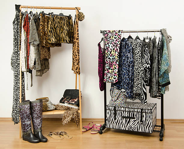 istock Dressing closet with animal print clothes arranged on hangers. 489274475