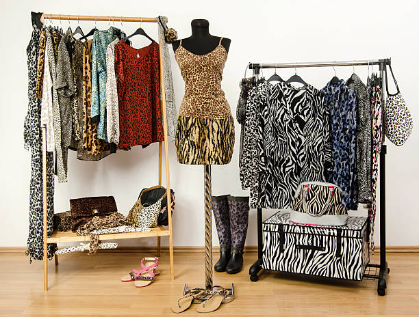 istock Colorful wardrobe with jungle pattern clothes and accessories. 489274487