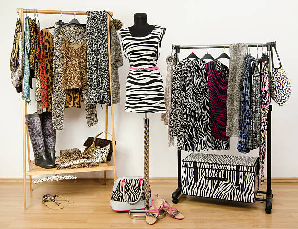 istock Colorful wardrobe with jungle pattern clothes and accessories. 489274489