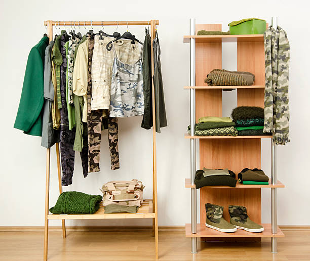 istock Wardrobe with camo pattern clothes, shoes and accessories. 489274493
