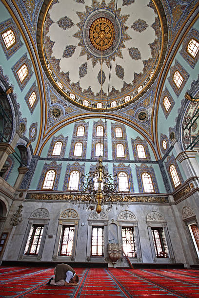 Praying Muslim man in a mosque