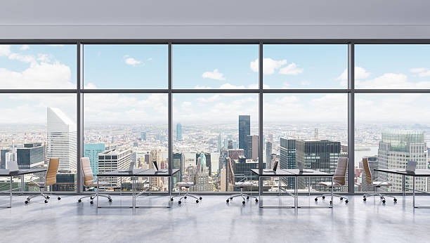 istock Workplaces in a modern panoramic office, New York city view 489301166