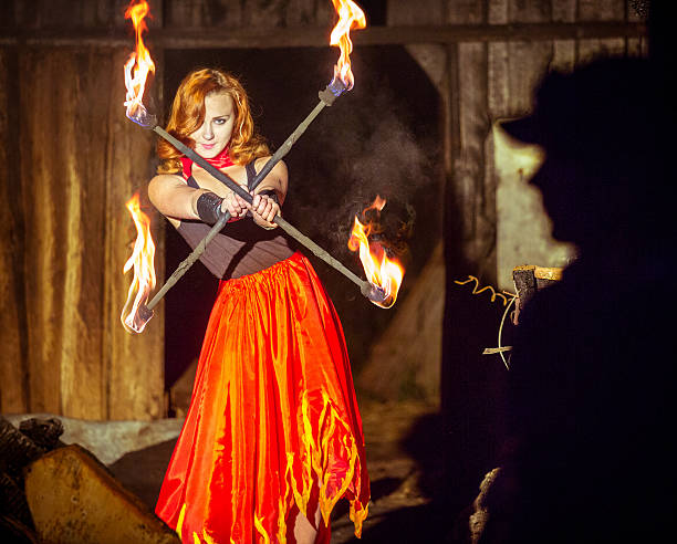istock Girl with Two Burning Staffs 489301718