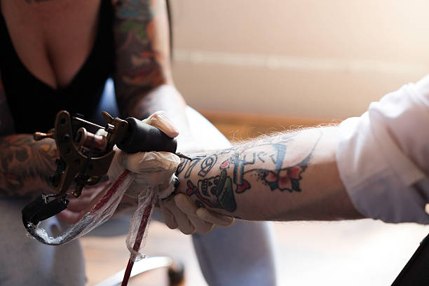 istock Topping Up the Tatt 489302844