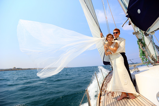 beautiful couple - bride and groom - a trip on a yacht
